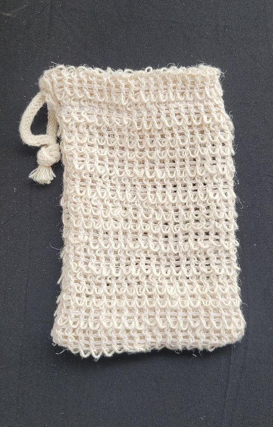 Textured white pouch with drawstring on a dark surface